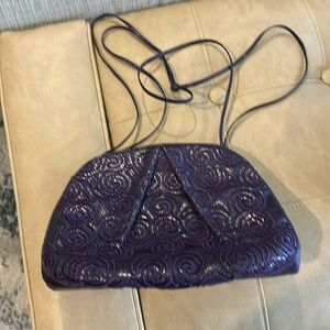 Judith Leber inembossed  purple evening bagwith small strap with three parts